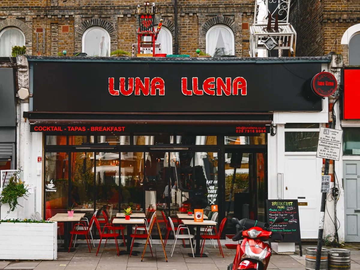 The Luna Llena shopfront on Stroud Green Road, red lettering on a black fascia